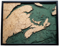 Canadian Maritimes 3D wood wall map in a dark frame, layered Baltic birch cut to real depth data