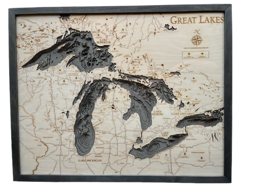 Great Lakes 3D wood wall map in a grey frame, angled view showing the laser-cut depth layers