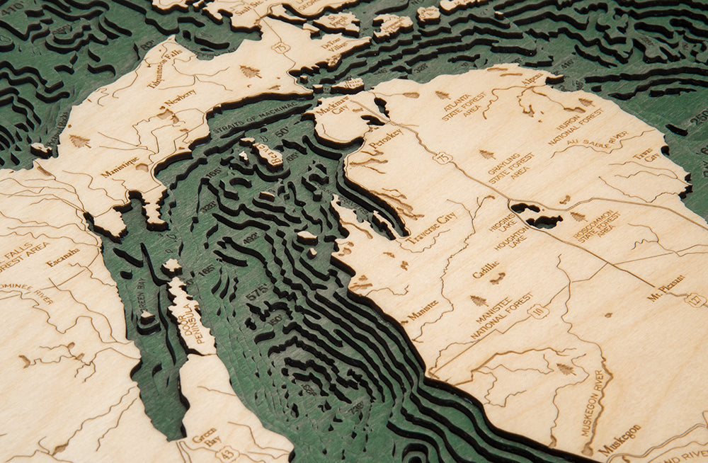 Close-up of the Great Lakes wood map showing the stacked, hand-stained depth layers