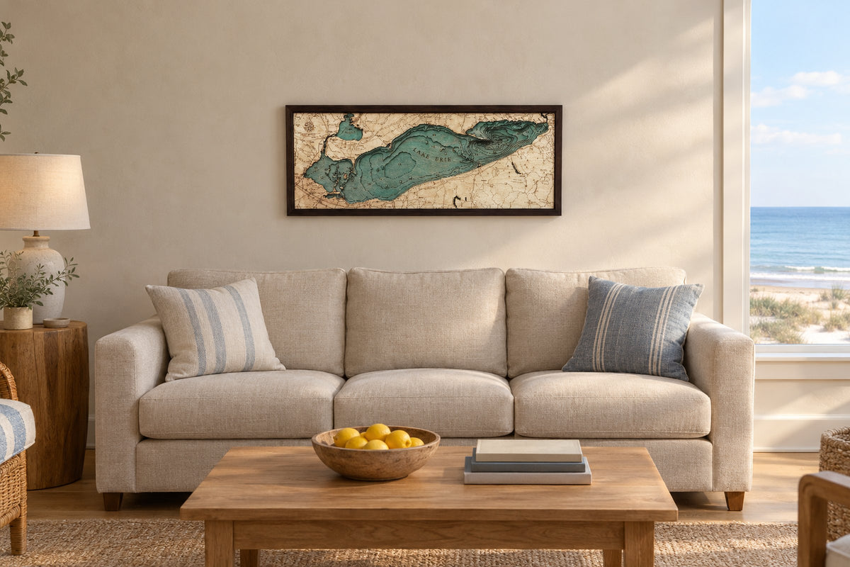 Lake Erie layered wood map, 78.7 by 33 cm, hanging above a three-seat sofa in a bright beach-house living room